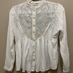 White top with an elegant leaf pattern. Size is extra small.